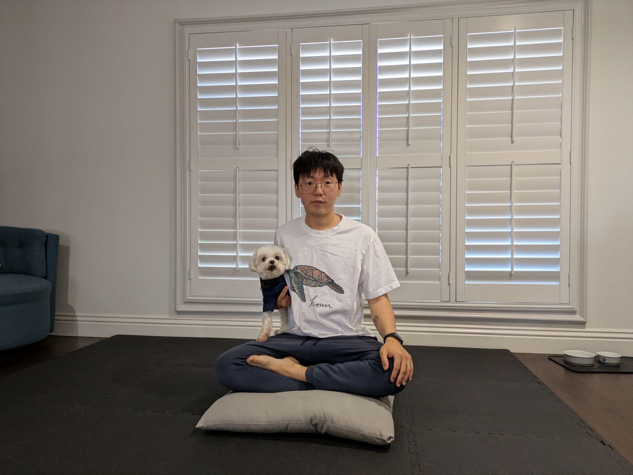 Sitting on a folded meditation cushion